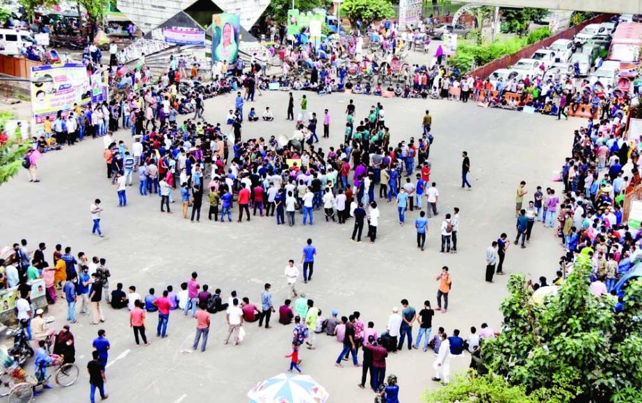 Dhaka University students and members of a religious group stage a protest in the Shahbagh area on Monday and presented a list of seven demands, including the 'strict punishment' of those involved in the recent attacks on the temples, homes and business