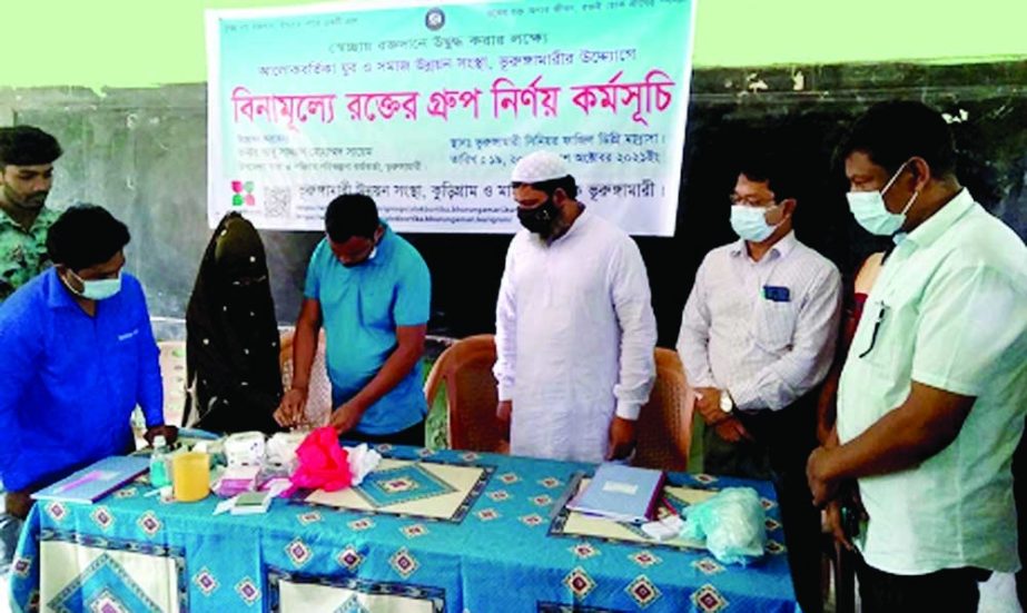 Upazila Health and Family Planning officer Dr. Abu Sazzad Mohammad Sayem inaugurates a free blood group diagnosis programme at Bhurungamari upazila of Cumilla on Tuesday. NN photo