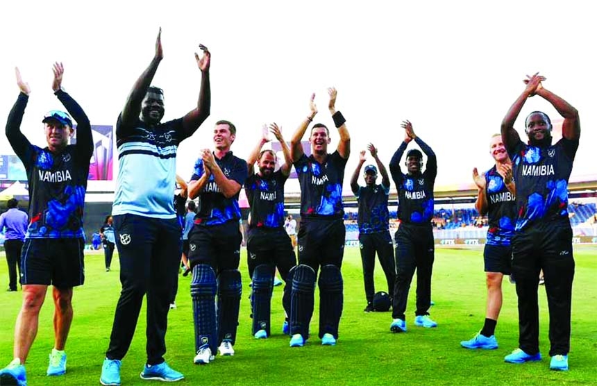 Namibia celebrate their win over Ireland and qualification for the Super 12 stage of the T20 World Cup.