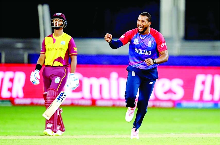 England's Chris Jordan celebrates to take the wicket of Dwayne Bravo during the ICC Twenty20 World Cup 2021 Super 12s match against West Indies in Dubai on Saturday.