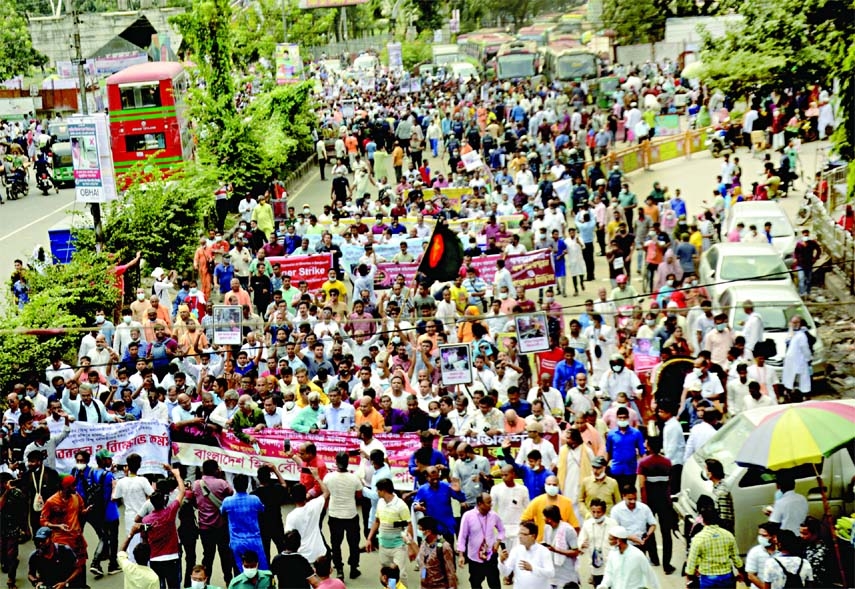 Several hundred people from different organisations of the Hindu community observe a sit-in and mass hunger strike at the capital's Shahbagh intersection on Saturday protesting the recent attacks on temples and vandalism of idols.