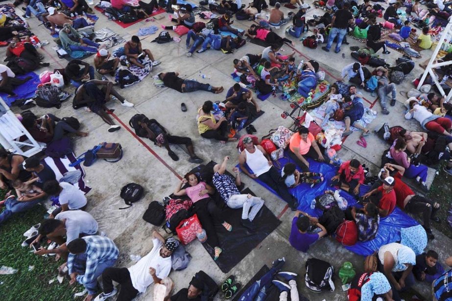 A caravan of migrants, mostly from Central America, heading north, stop to rest in the Alvaro Obregon community, Tapachula municipality, Chiapas state, Mexico, Saturday, Oct. 23, 2021.