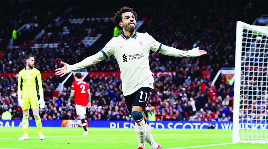 Liverpool's Mohamed Salah celebrates scoring their fifth goal and his hat-trick against Manchester United on Sunday.