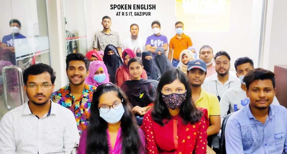 Students of RS IT Institute in Gazipur pose for a photograph after receiving on completion of a computer training and spoken english couse. NN photo