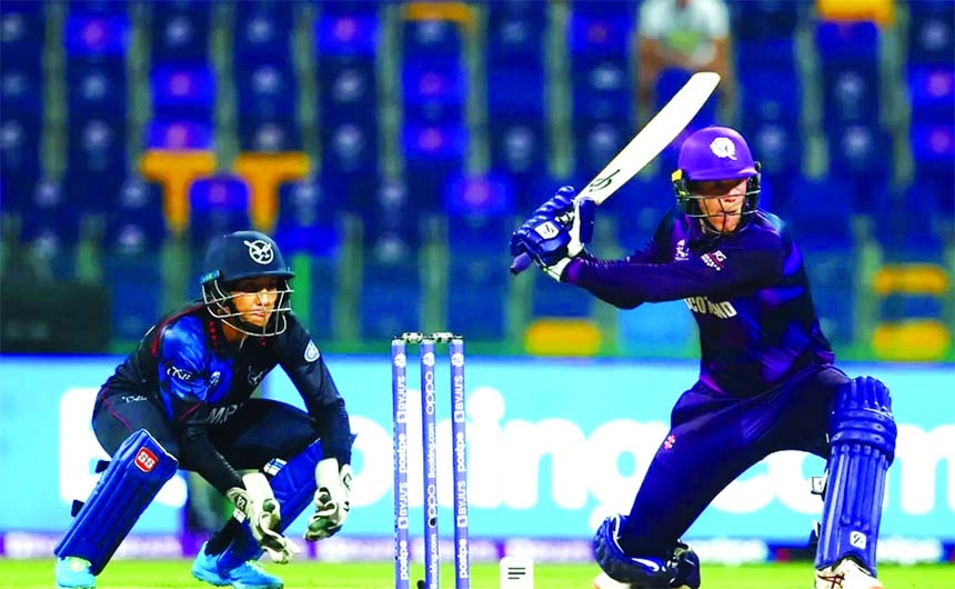 Michael Leask (right) of Scotland hits a ball, while wicketkeeper Zane Green of Namibia watches during their Group-2 match of the ICC T20 World Cup at Sheikh Zayed Cricket Stadium in the United Arab Emirates on Wednesday. Leask top-scored with 44 runs.