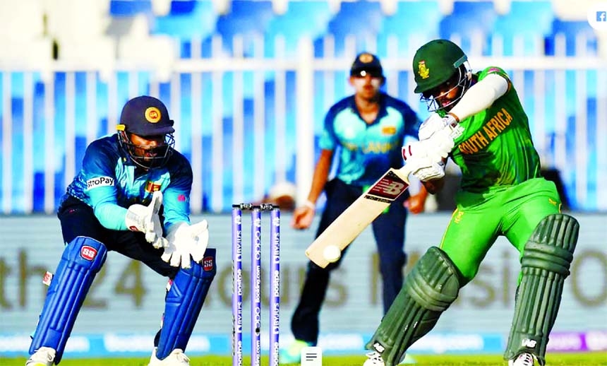 Temba Bahuma (right) of South Africa drives a ball, while wicketkeeper Kusal Perera of Sri Lanka watches during their Group-1 match of the ICC T20 World Cup at Sharjah Cricket Stadium in the United Arab Emirates on Saturday. Bahuma hit 46.