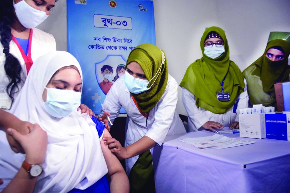 A student gets Covid-19 vaccine at the Ideal School in Dhaka's Motijheel on Monday. NN photo