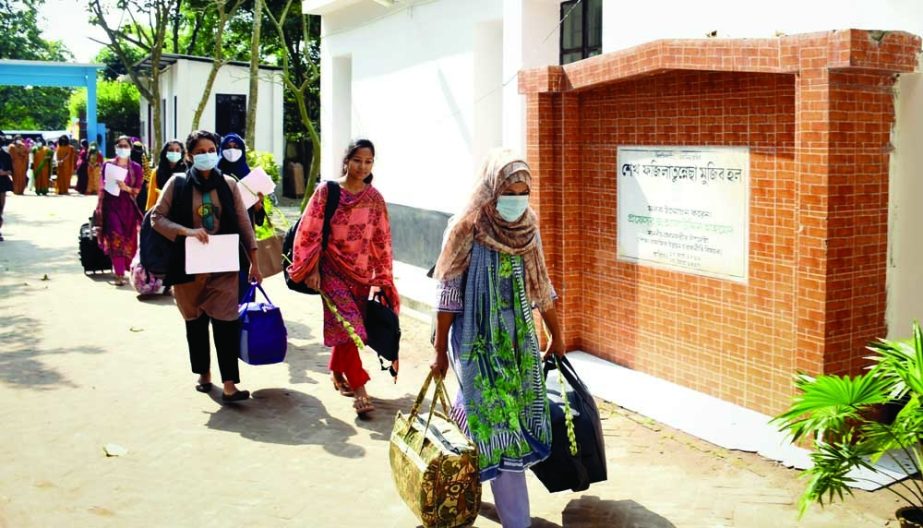 Female students of Farilo BRU returning to their halls with luggage It is done whenever any institution opens after closure. NN photo
