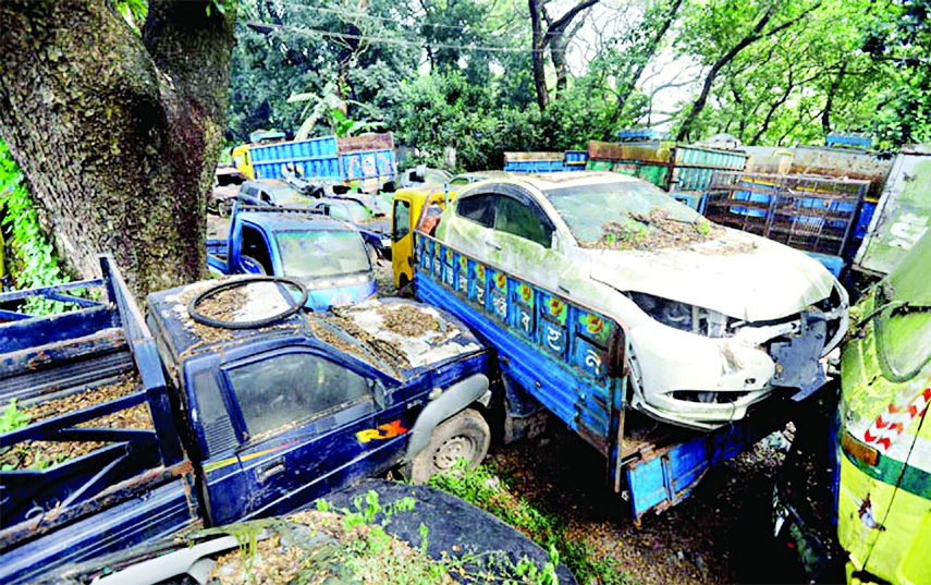 Costly vehicles remain idle in a dump yard for years. As a result, they get damaged for lack of proper maintenance. This photo was taken from Shahbagh police control room in the capital on Wednesday.