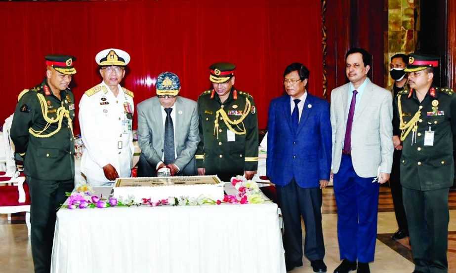 President Abdul Hamid cuts cake at National Standard awarding ceremony to BNS Shaheed Moazzem at Kaptai Shahed Moazzem Parade Ground through video conference from Bangabhaban on Thursday. PID photo