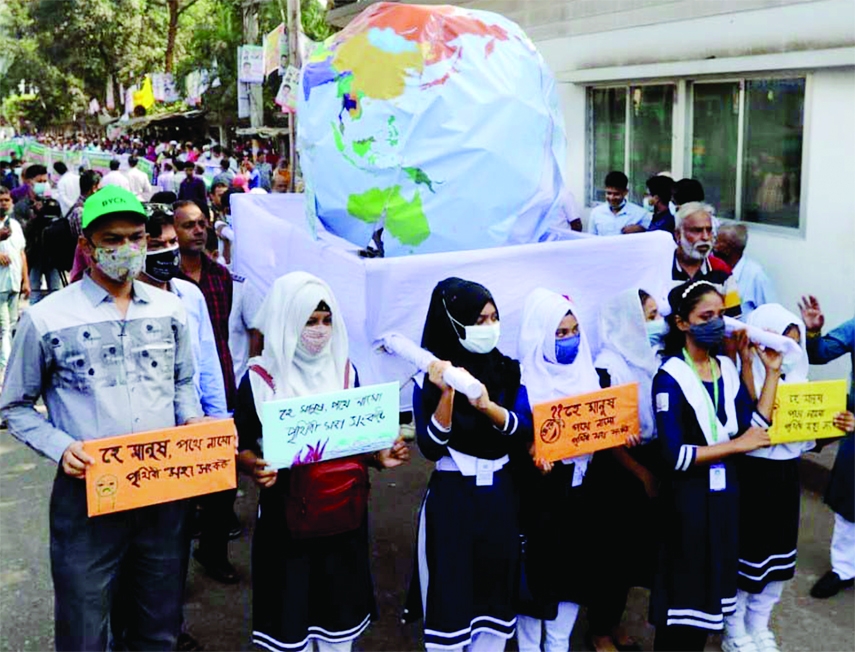 Different organization bring out procession and form human chain in front of Jatiya Press Club in the city on Thursday demanding immediate initiatives to save the planet from the adverse impacts of climate change.