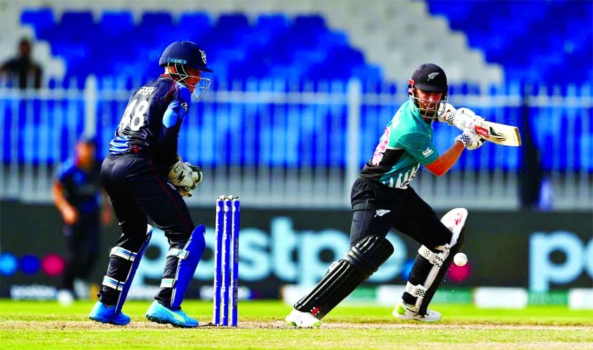 Kane Williamson (right) of New Zealand steers a ball, while wicketkeeper Zane Green of Namibia looks on during their fourth Group-2 match of the ICC T20 World Cup at Sharjah Cricket Stadium in the United Arab Emirates on Friday.