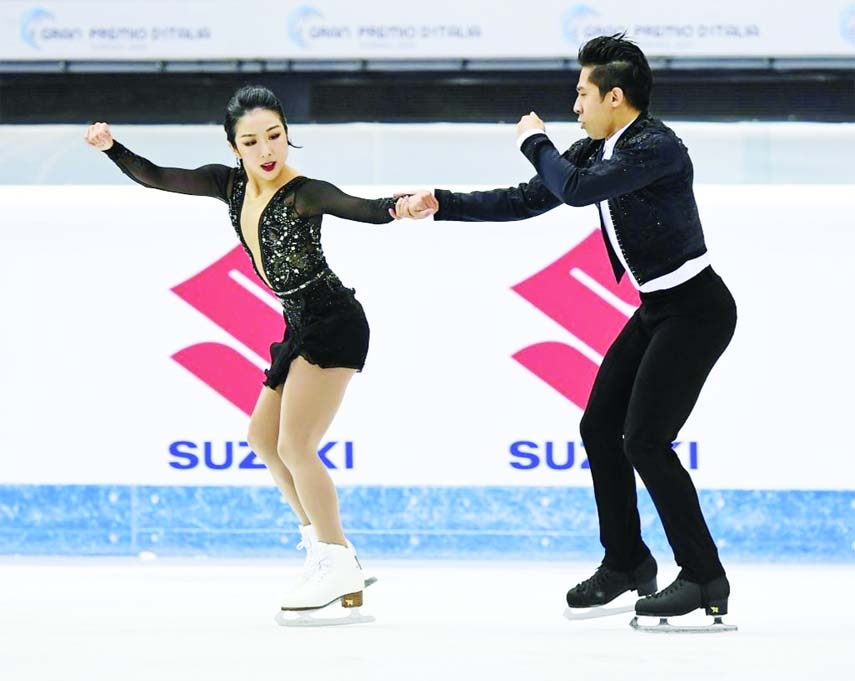 Sui Wenjing (left)Han Cong of China compete during the Pairs' Short Program at the International Skating Union (ISU) Grand Prix of Figure Skating in Turin, Italy, on Friday.