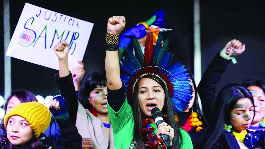 Indigenous people from Brazil speak from the stage during a demonstration in Glasgow, Scotland on Friday. Agency photo