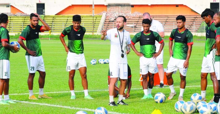 Interim Head Coach of Bangladesh Football team Mario Lemos (centre) and his boys during their practice session at the Bangabandhu National Stadium recently.