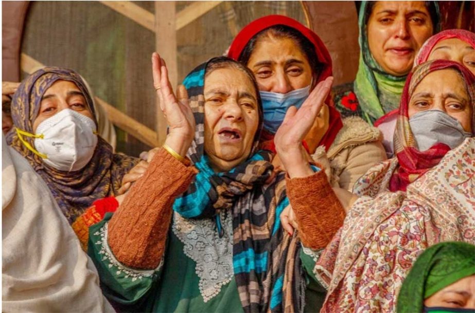 Mohammad Ibrahim Khan's mother, centre, grieves with other women during his funeral in Srinagar Agency photo