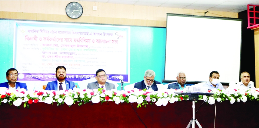ISHWARDI (Pabna) : Senior Secretary of the Ministry of Agriculture Mesbahul Islam speaks to the scientists and officials of Bangladesh Sugar-crop Research Institute in a view exchange meeting held at its Auditorium on Tuesday.