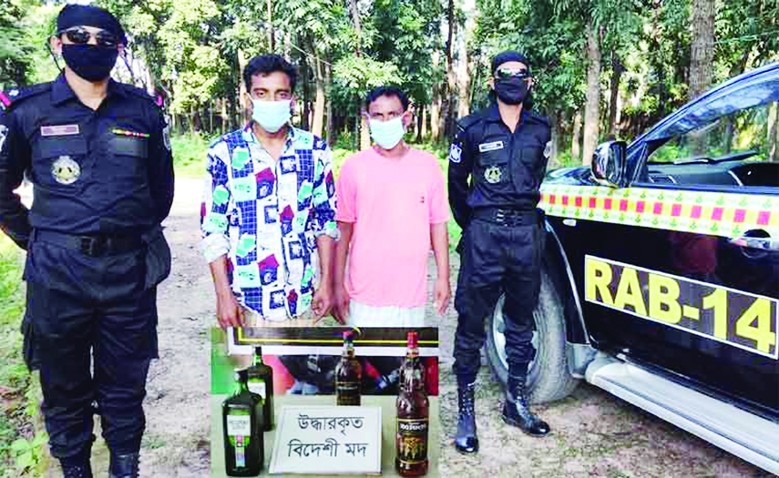 KISHOREGANJ : Two suspected drug dealers were held by members of RAB-14 with 5 bottles foreign liquors from Bajitpur town on Monday.