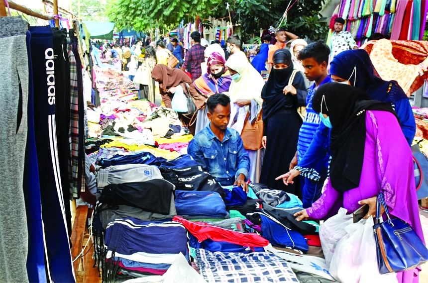 Wayside winter garment shop attract customers in front of Ideal School in the capital on Wednesday ahead of winter.