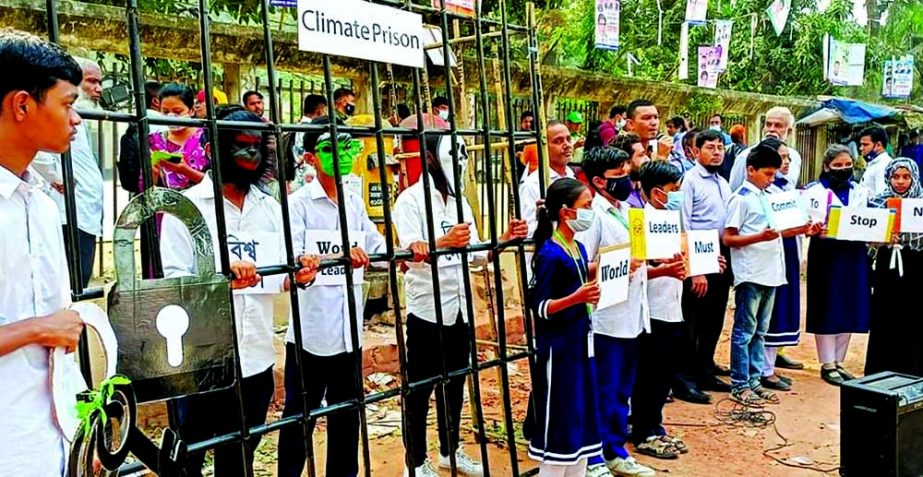 A symbolic programme was orgainsed in front of Jatiya Press Club on Wednesday putting world leaders behind the bars for their terrible failure to commit adequately to fight climate change. NN photo