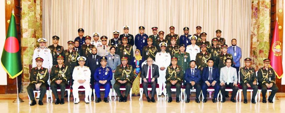President Abdul Hamid poses for a photo session with participants in National Defence Course and Armed Forces War Course-2021 at Bangabhaban on Thursday. PID photo