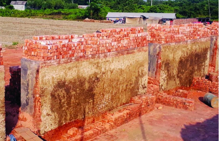 MIRAZAPUR (Tangail): Burning of bricks not being possible due to shortage of coal. The snap was taken from a brickfield at Bashtoli area on Friday. NN photo