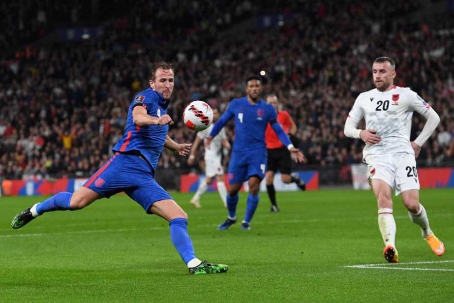 England's striker Harry Kane (left) shoots past Albania's midfielder Lorenc Trashi (right) but wide of the goal during the FIFA World Cup 2022 Group I qualifier football match at Wembley Stadium in London on Friday. Agency photo