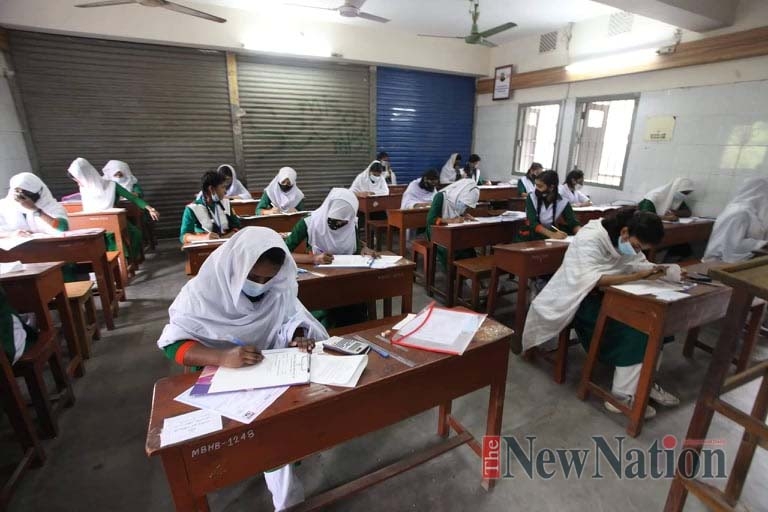 Secondary School Certificate (SSC) and its equivalent examinations began on Sunday, maintaining health protocols. This photo was taken from Motijheel Idle School and college. Photo : Moin Ahamed