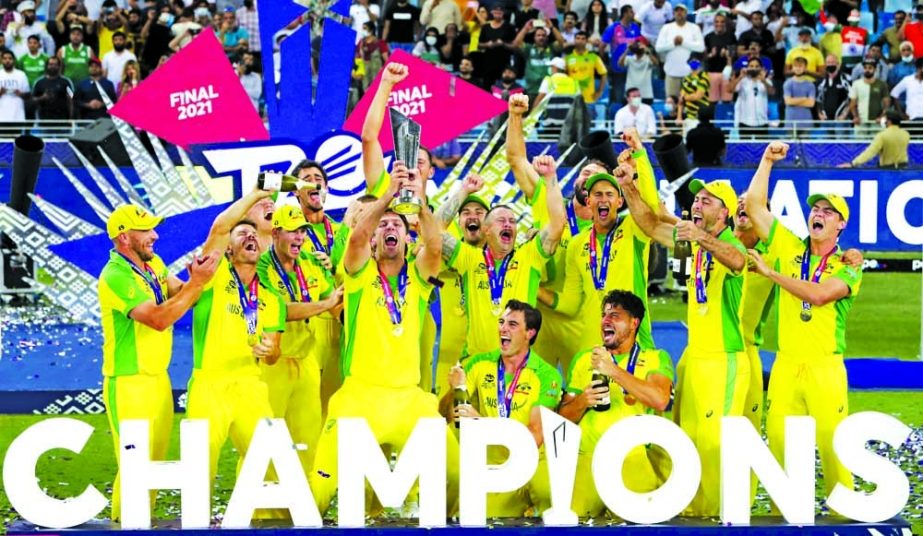 Australian players celebrate after their victory against New Zealand in the Twenty20 men's World Cup cricket final in Dubai on Sunday. Agency photo