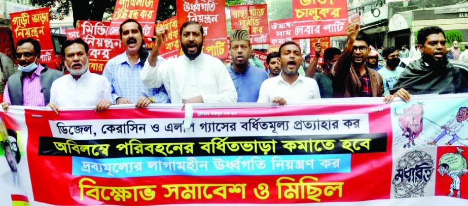 Bangladesh Labour Party brings out a procession in the city's Topkhana Road on Monday demanding withdrawal of increased fare of diesel and kerosene. NN photo