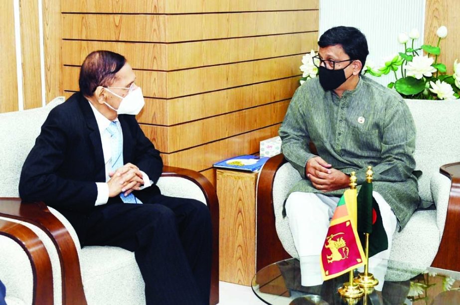 Visiting Sri Lankan Foreign Minister Prof. Gamini Lakshman Peiris calls on State Minister for Shipping Khalid Mahmud Chowdhury at the latter's office of the ministry on Tuesday. NN photo