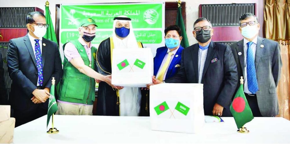 Envoy of Saudi Arabia to Bangladesh Abdullah Bin Naser Al Basiri hands over Covid vaccine to Foreign Minister Dr. AK Abdul Momen at the State Guest House Padma in the city on Tuesday. Health Minister Zahid Maleque was present on the occasion. NN photo