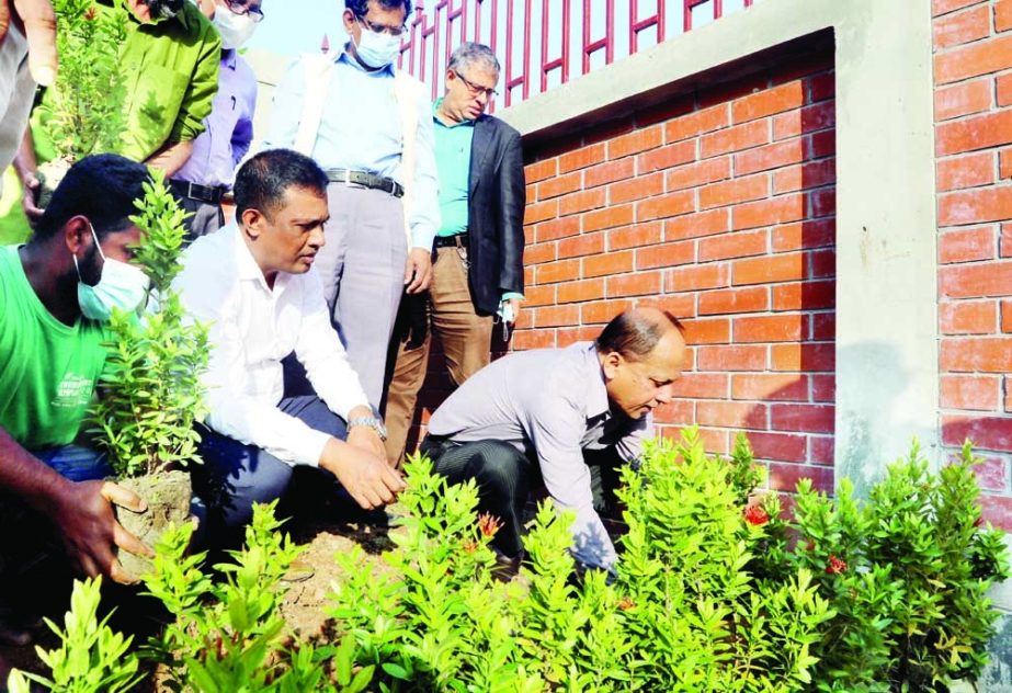 DG of National Science and Technology Museum Munir Chowdhury plants saplings in the garden adjacent to the newly constructed gate of the museum in the city on Wednesday. NN photo