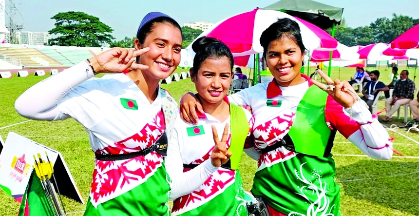 Diya Siddique, Beauty Roy, Nasrin Akter of Bangladesh showing victory sign after clinching bronze medal in the Women's Recurve Team event of the Asian Archery Championship at the Army Stadium in the city's Banani on Wednesday.