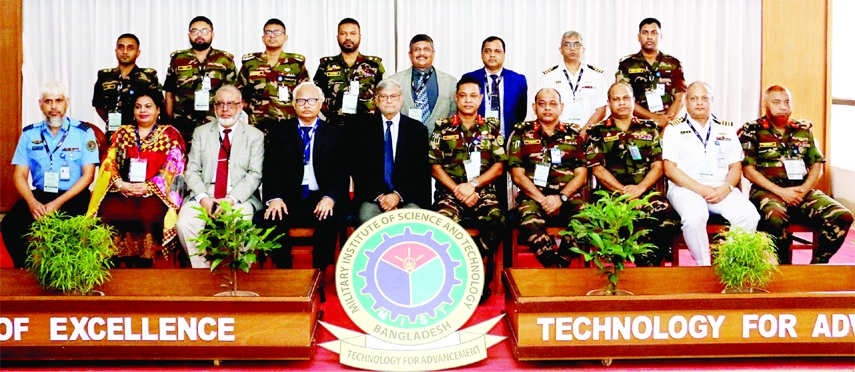 Planning Minister MA Mannan poses for a photo session with the participants in a conference on 'Electrical and Electronic Engineering and Information and Communication Technology' at MIST in the city on Thursday.