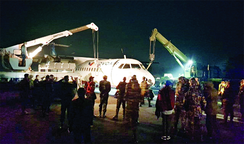 Bangladesh Army removes a stranded aircraft of Novoair from the runway at Saidpur Airport on Wednesday evening.