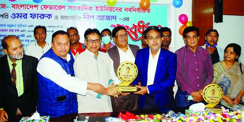 Abdus Salam Murshedy, MP along with others, at a reception accorded to the newly elected BFUJ President and Secretary General Omar Faruque and Dip Azad respectively by Dhaka based Khulna Journalists Forum at the Jatiya Press Club on Saturday.