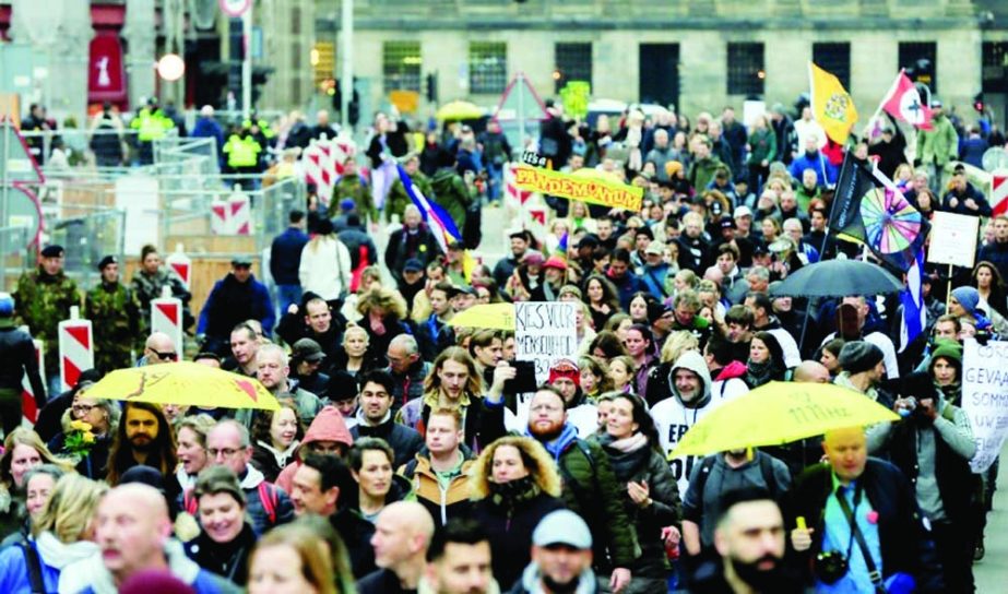 People protest during demonstrations against Covid-19 measures in Amsterdam, Netherlands, on November 20. Agency photo