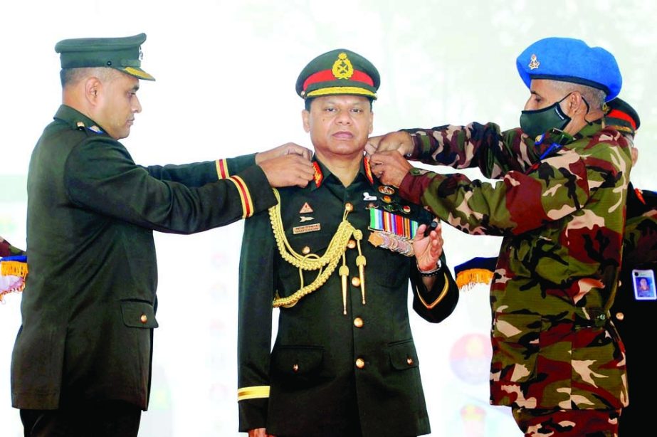 Chief of Army Staff General SM Shafiuddin Ahmed being adorned with Colonel Rank Badge at the Colonel Commandant installation ceremony of Corp of Engineers at Kadirabad Cantonment in Natore on Wednesday. ISPR photo