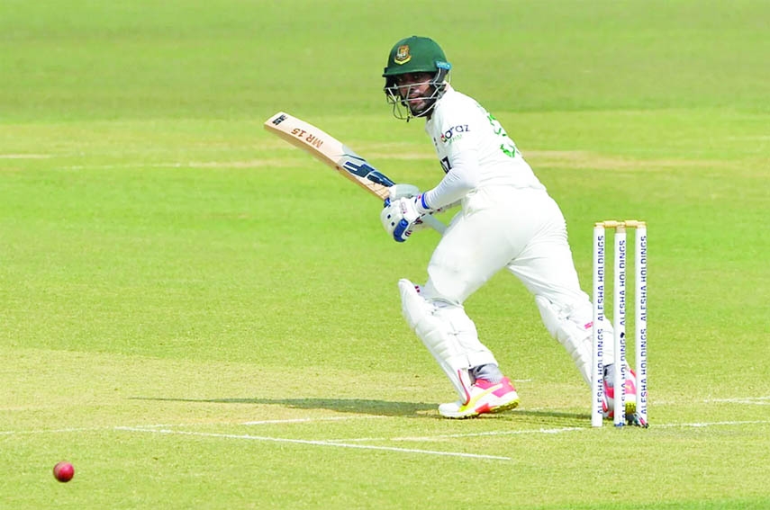 Mehidy Hasan Miraz of Bangladesh steers a ball towards the third man in his first innings against Pakistan on day 2 of the first Test at the Zahur Ahmed Chowdhury Stadium in Chattogram on Saturday. Miraz remained unbeaten with 38 runs.