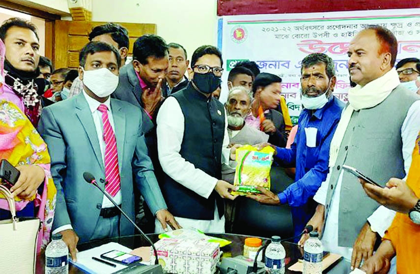 NATORE: ICT State Minister Zunaid Ahmed Palak distributed paddy seeds and fertilizer among the small and marginal farmers at Singra Upazila organised by Singra Upazila Parishad on Sunday.