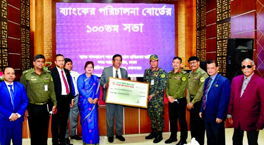 Md Mosaddek-Ul- Alam, Managing Director of the Anser VDP Development Bank, handing over cheque to Major General Mizanur Rahman Shameem, Chairman of the bank, at the bank's head office recently.