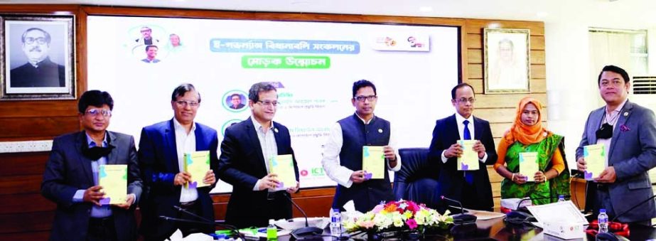 State Minister for ICT Zunaid Ahmed Palak, among others, holds the copies of a book titled 'E-Governance Rules' in the seminar room of ICT Division in the city on Wednesday. NN photo