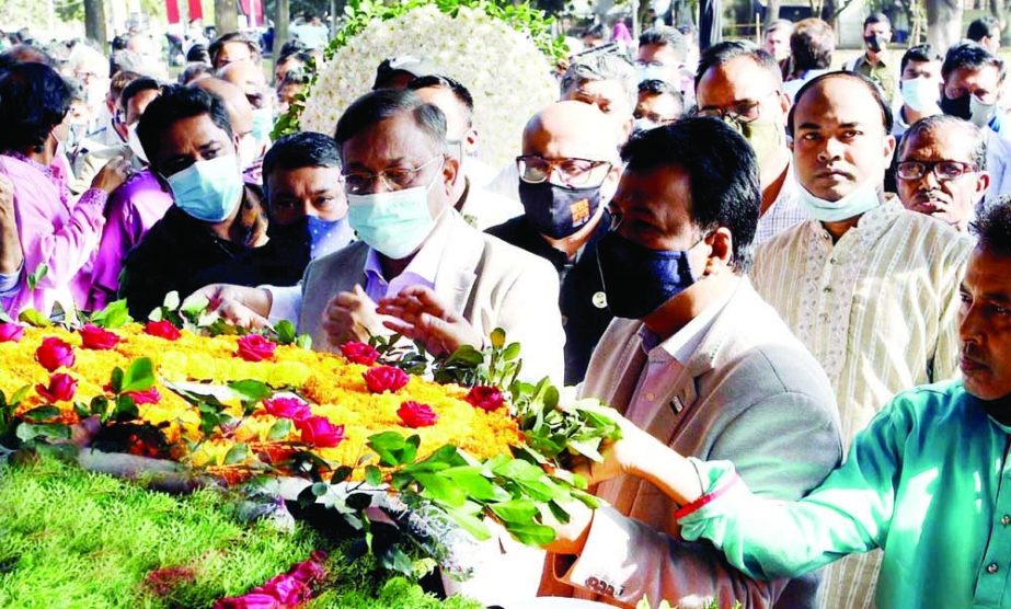 Information and Broadcasting Minister Dr. Hasan Mahmud along with others pays floral tributes on the coffin of National Professor Dr. Rafiqul Islam at the Central Shaheed Minar in the city on Wednesday. NN photo