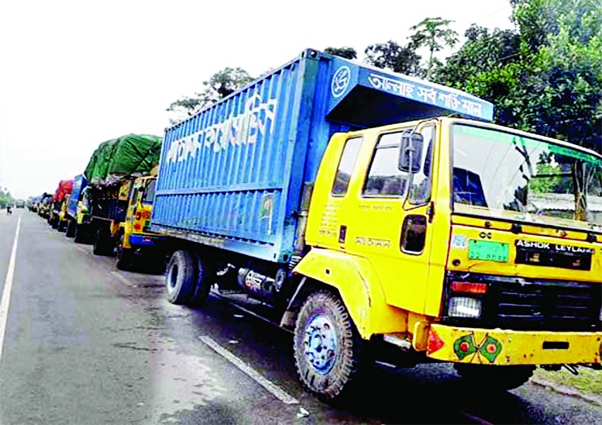 Hundreds of goods-laden trucks get stuck at Goalondo ghat in Rajbari district on Wednesday due to dense fog.