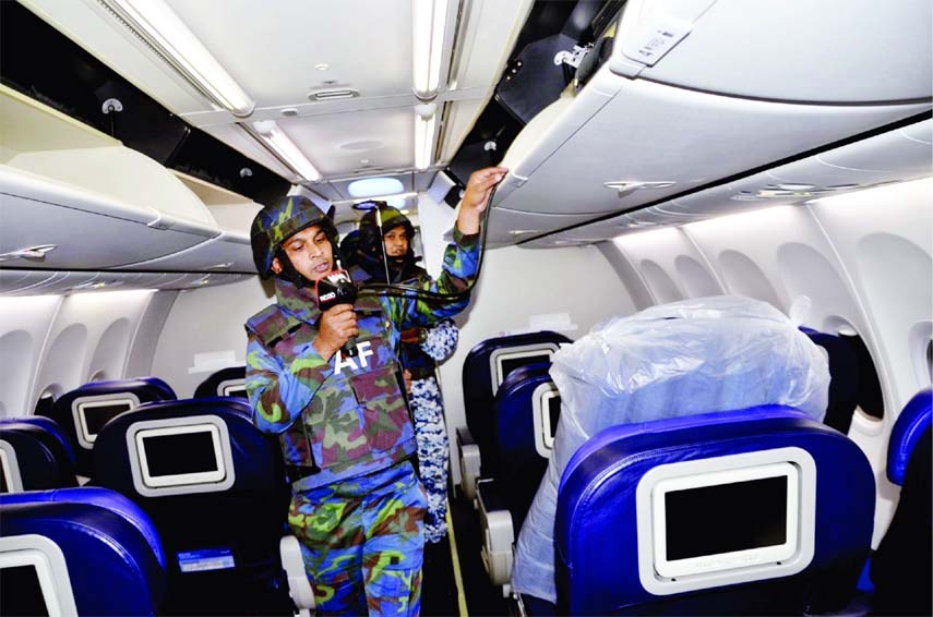 Members of the Air Force bomb disposal unit conduct search operation inside an aircraft of Malaysia Airlines at Hazrat Shahjalal International Airport on Wednesday following a bomb threat, which turned out to be a hoax.