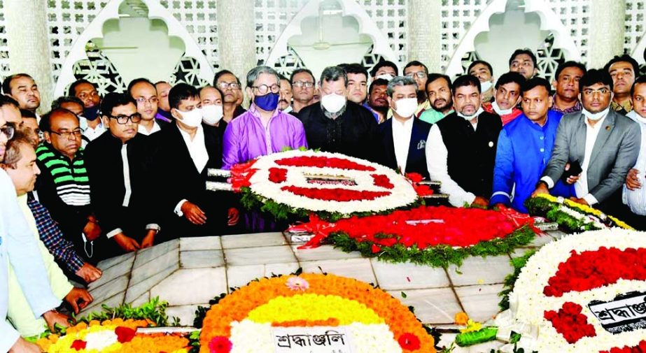 Leaders of central Jubo League place floral wreaths at the mausoleum of Huseyn Shaheed Suhrawardy on the premises of Dhaka University on Sunday on the occasion of his 58th death anniversary. NN photo