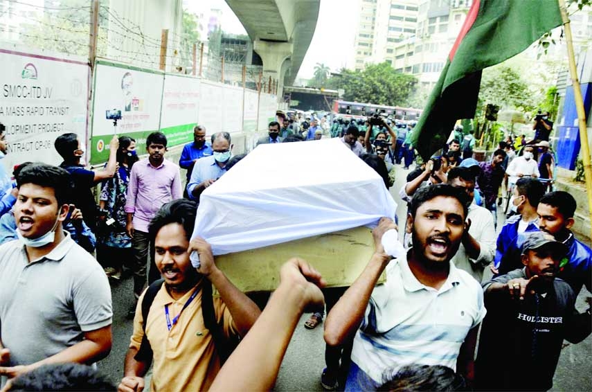 Students hold a symbolic 'coffin march' at Shahbagh in the capital on Sunday to press home their nine-point demand regarding safety on roads. NN photo