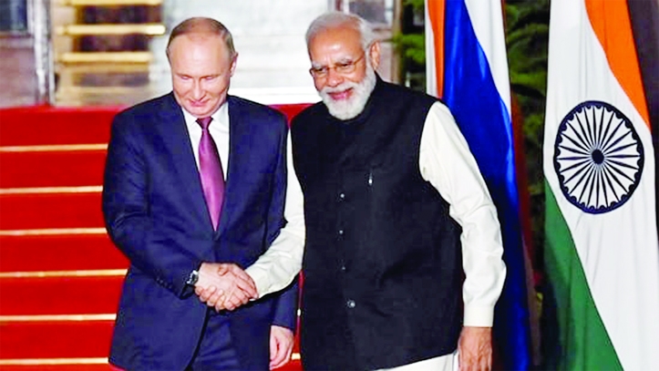 Indian Prime Minister Narendra Modi (R) greets Russian President Vladimir Putin before a meeting at Hyderabad House in New Delhi on Monday.