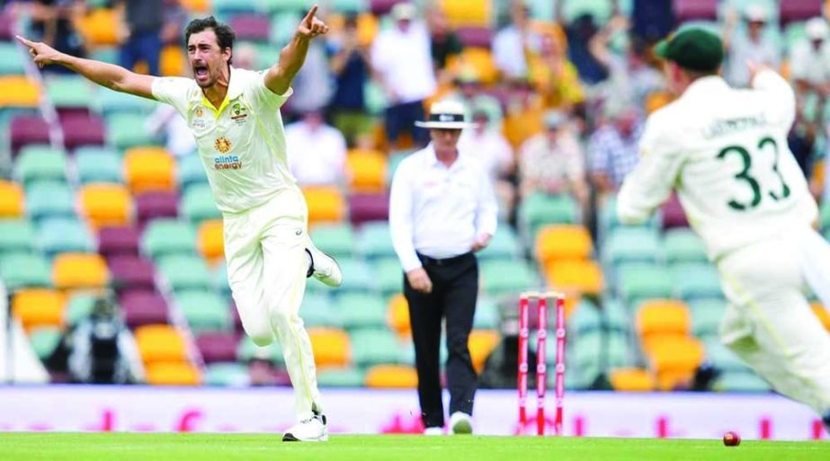 Left-arm pace bowler Mitchell Starc (left) of Australia took out England’s Rory Burns' leg stump with a swinging yorker on the first delivery of the Ashes series on Wednesday. AP photo